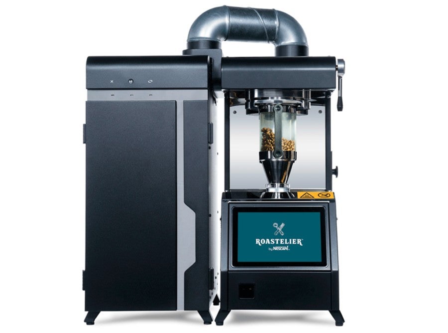 A coffee grinding machine that processes whole coffee beans into a ground form for making coffee.