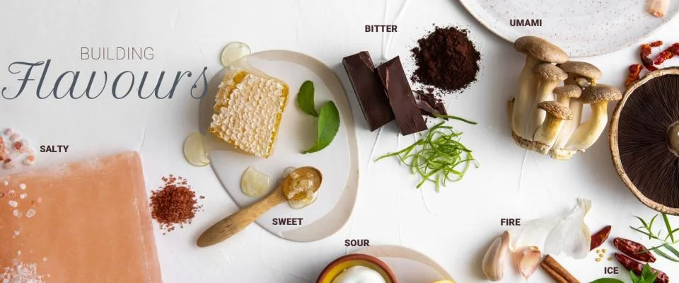 An assortment of ingredients showcasing different flavors: sweet, sour, bitter, umami, and fire.