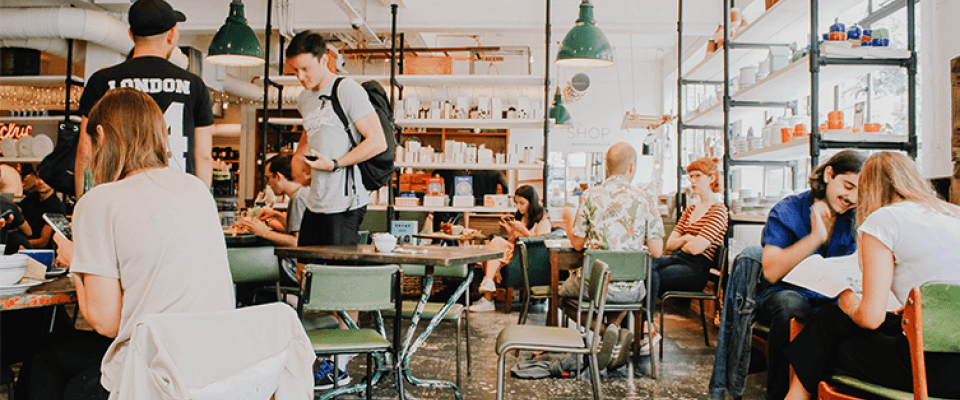 Unique restaurant concept with chefs preparing diverse dishes in a modern kitchen