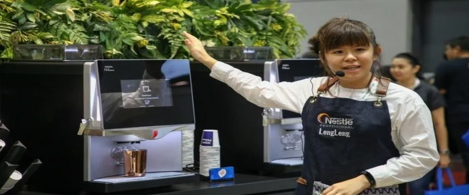 Choy Lengin Coffee preparing and serving coffee in a professional café setting