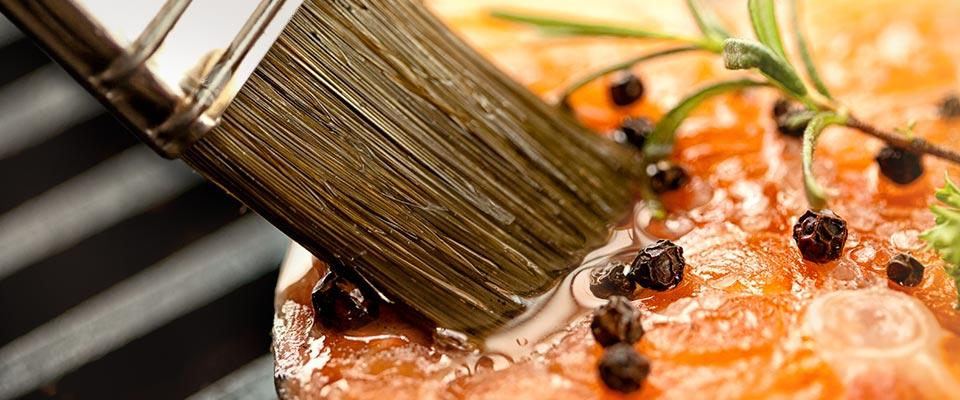 Chef preparing a dish with layers of flavor using fresh ingredients