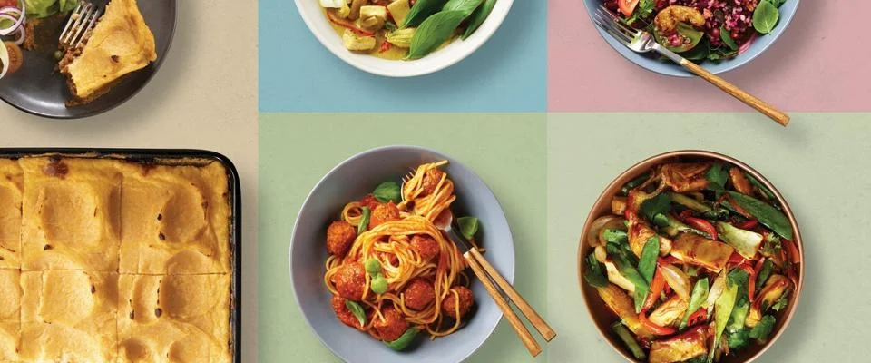 Assortment of foods on plates, highlighting diverse dishes and appealing colors.