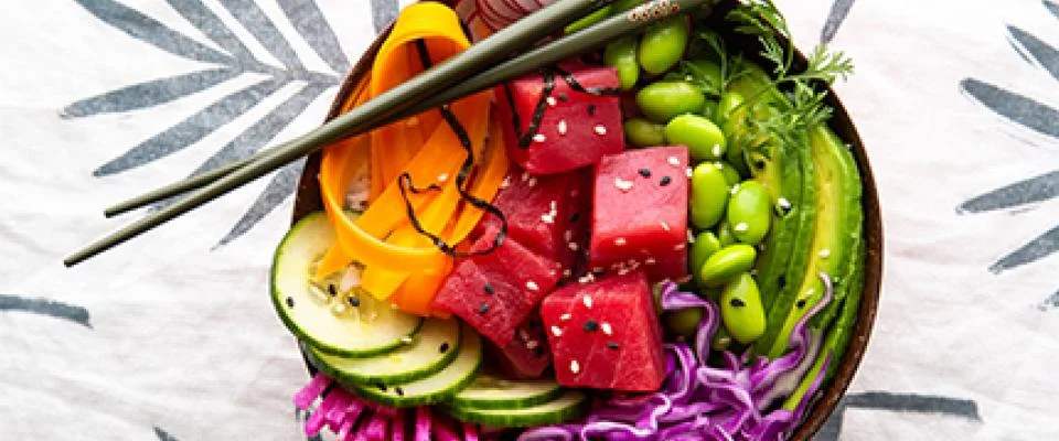 Chef arranging dishes to simplify menu choices in a professional kitchen