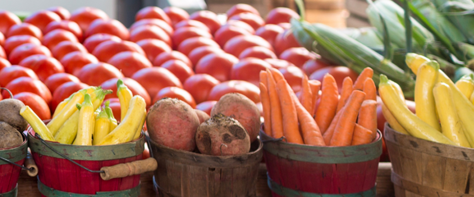 Baskets of fresh vegetables, showcasing plant-based options to avoid hidden animal-based foods.