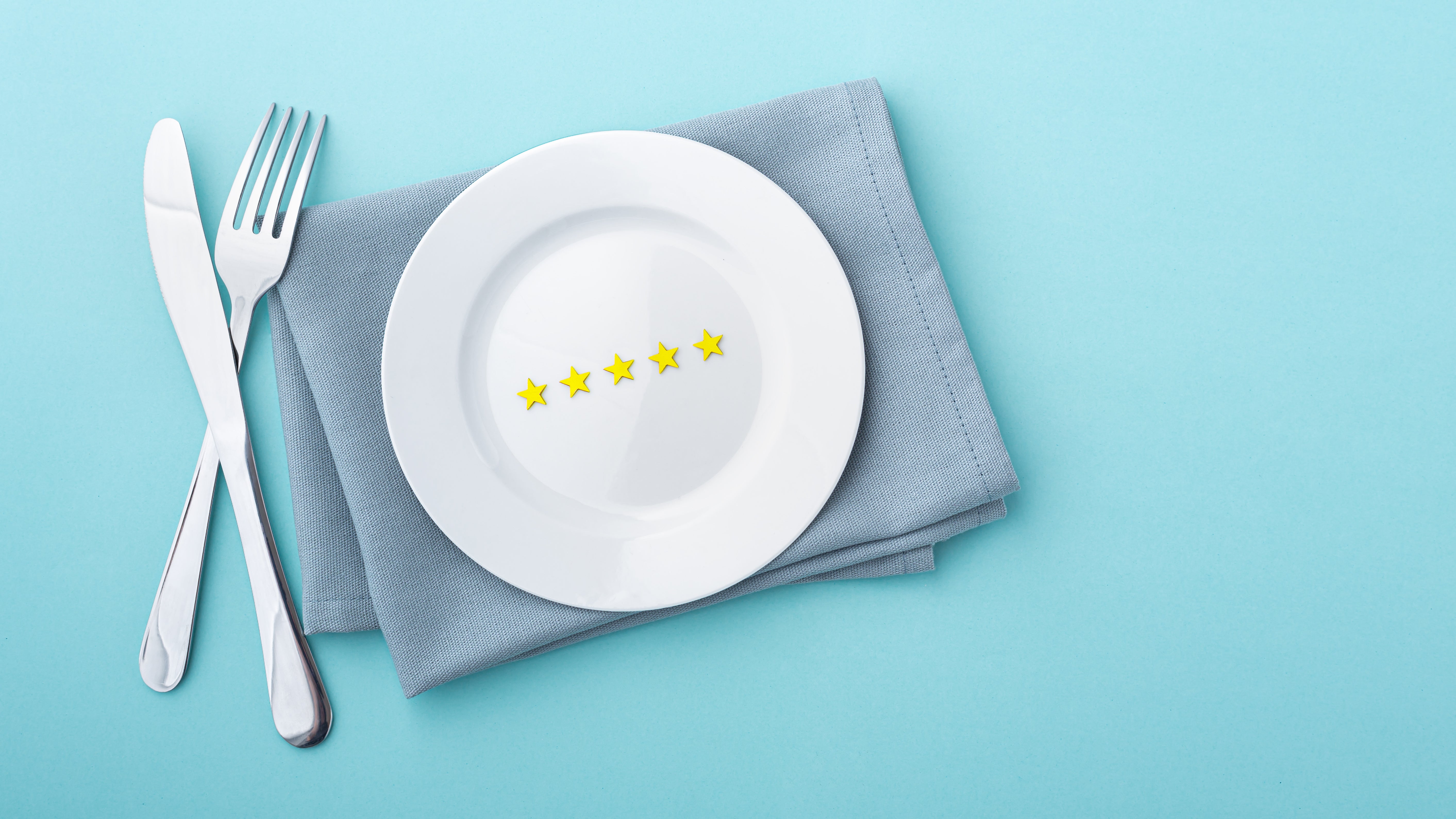 A plate displaying a prominent five-star rating, symbolizing excellence and high quality in dining or service.