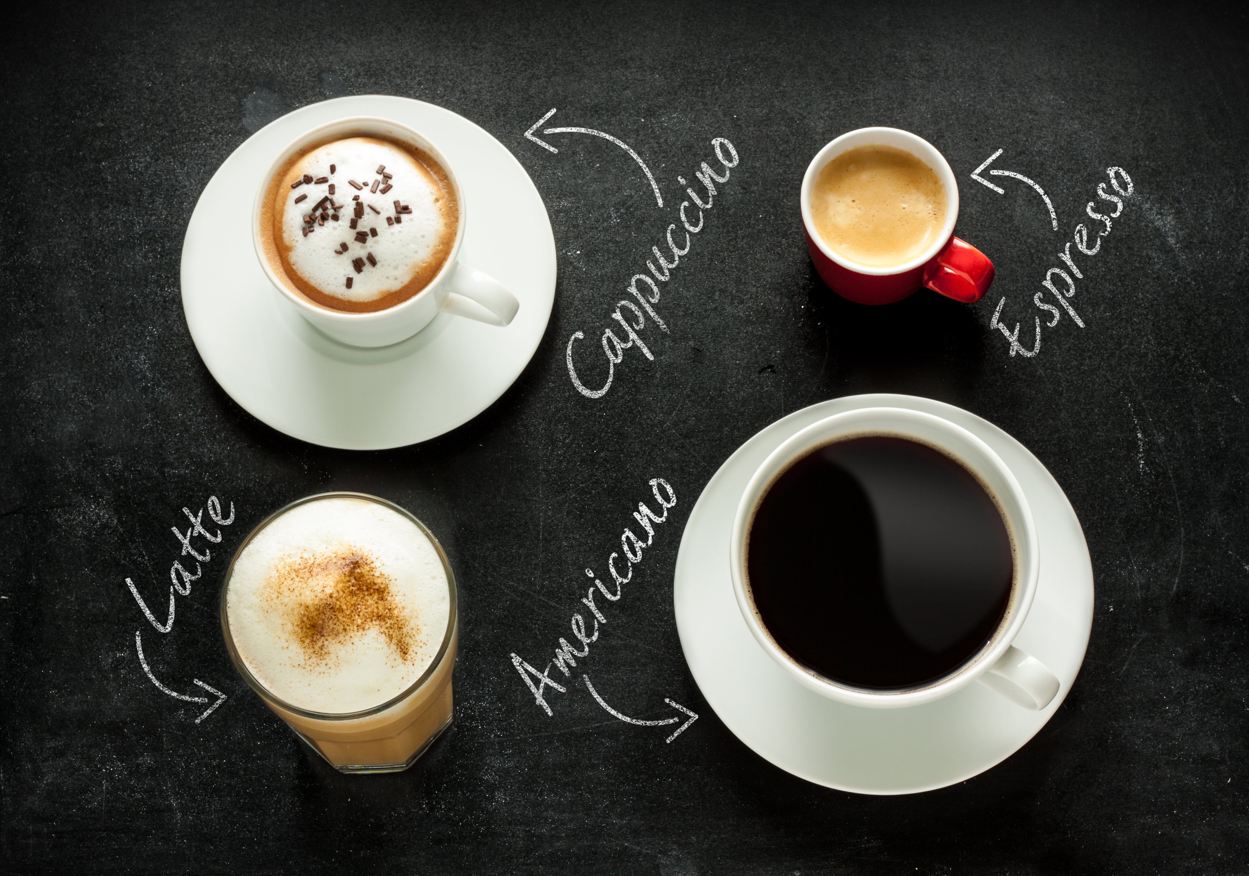 A chalkboard filled with different coffees, each labeled to show their characteristics and styles.