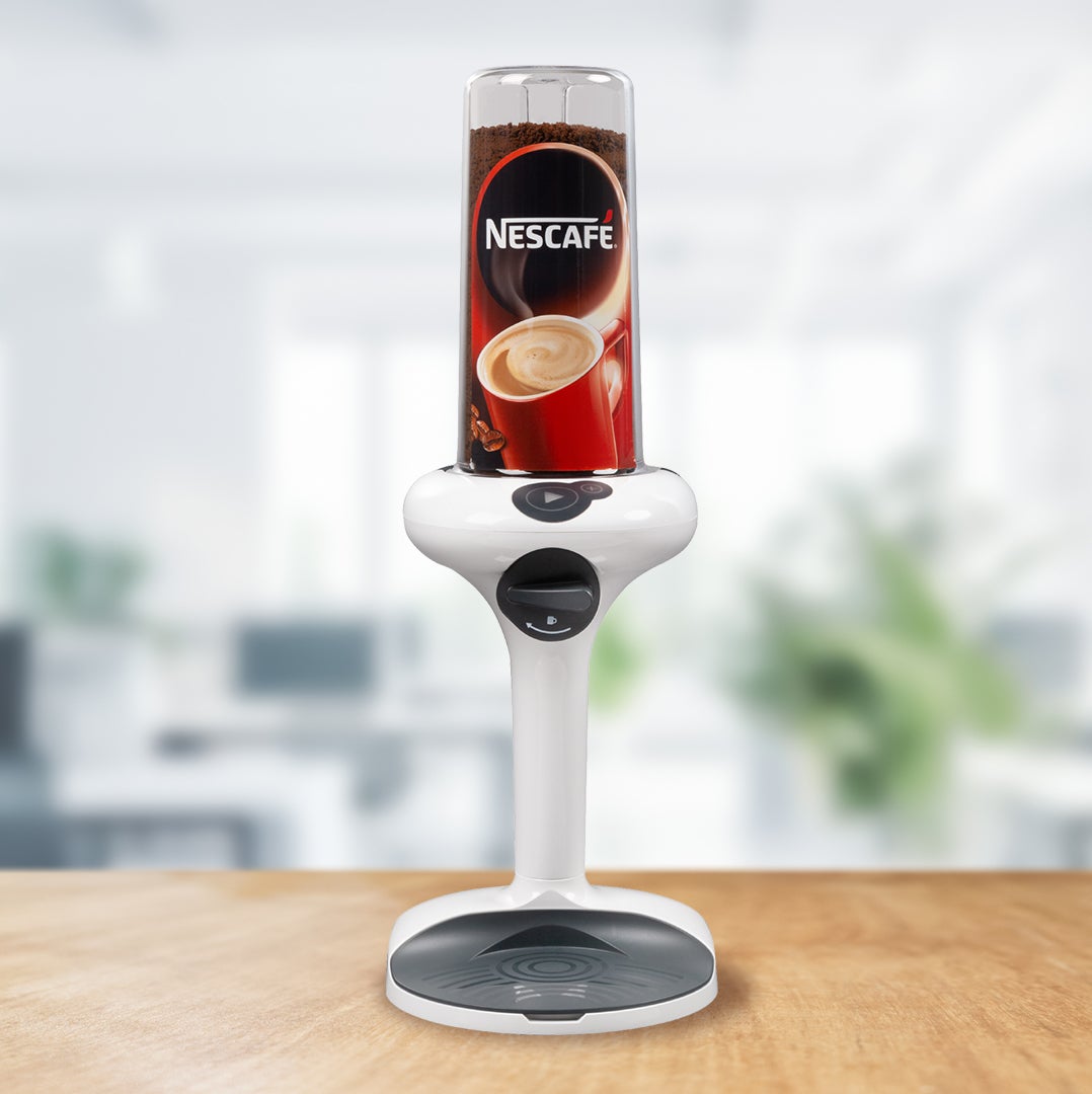 A coffee machine with a steaming cup of coffee placed on top, showcasing its sleek design and functionality.