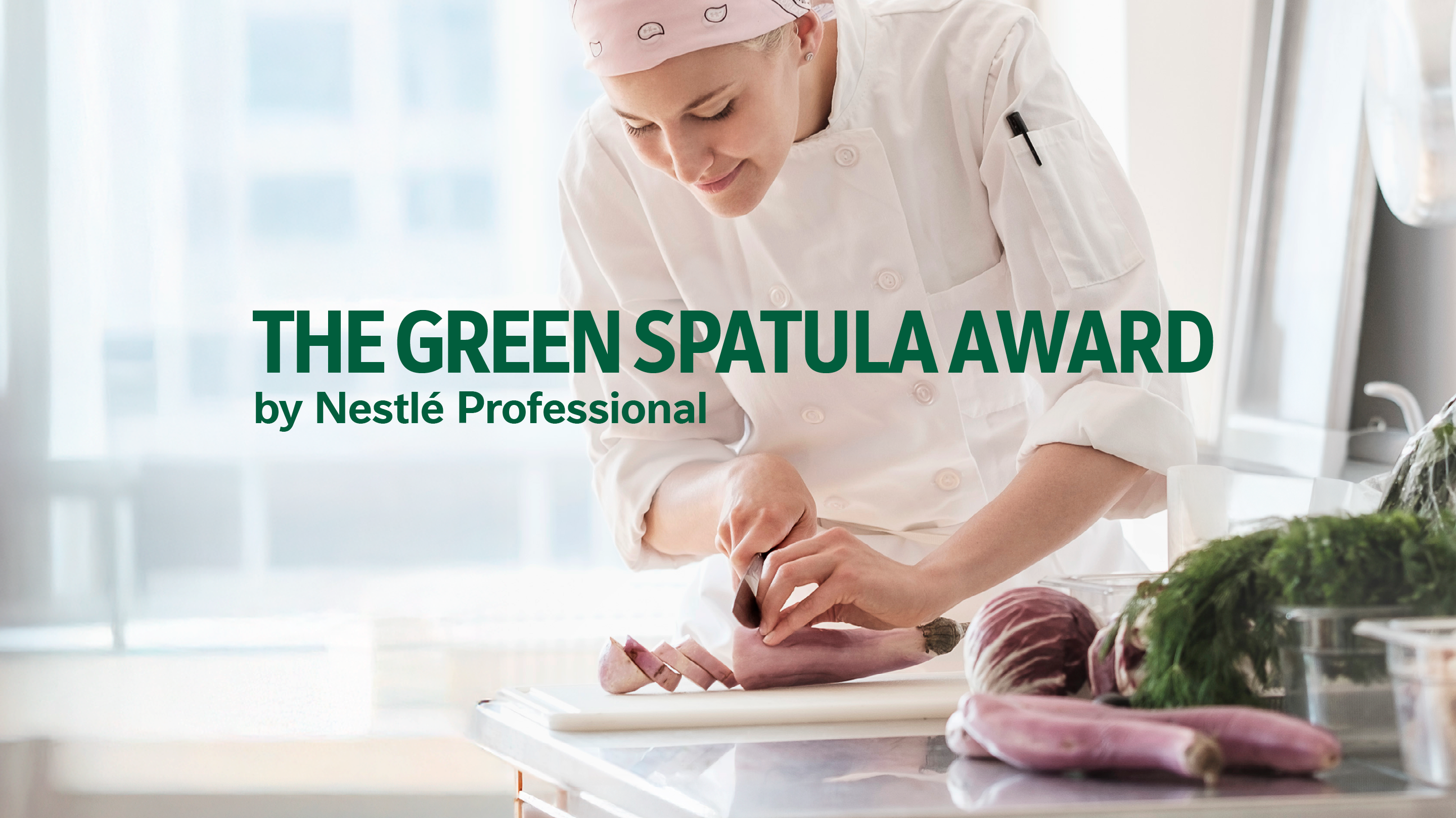 Female Chef carefully preparing a dish