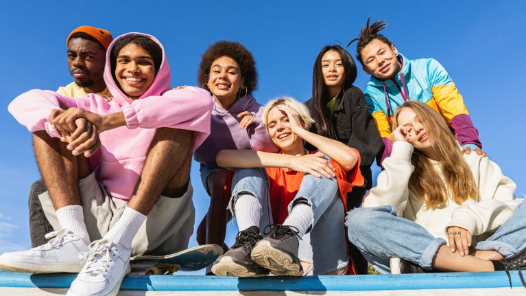 A group of Gen Z people wearing bright colors clothes