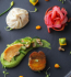 A plate filled with colorful food items, showcasing a variety of textures and flavors.