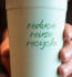 A paper cup with a green cap, promoting the message of reduce, reuse, recycle for sustainable consumption