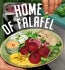 Colorful plate of Garden Gourmet beetroot falafels with pita breads and dips