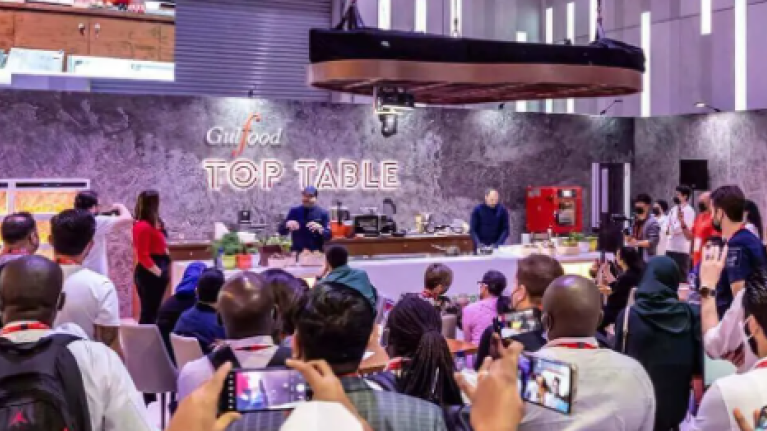 Attendees fill a large room at the Gulfood event in Dubai, 2026, creating a vibrant atmosphere of networking and engagement