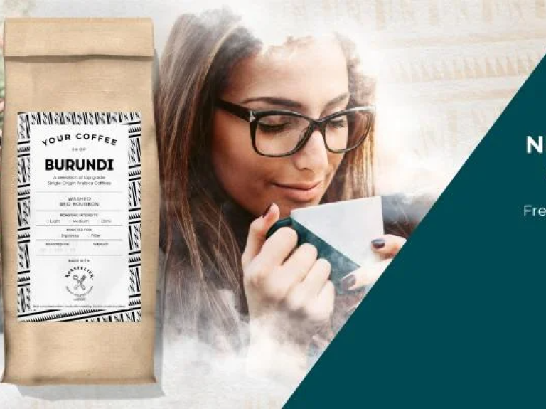 A woman enjoys a cup of coffee beside a bag of Burundi Coffee, freshly roasted and flavorful.