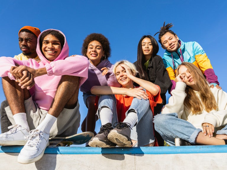 A group of Gen Z people wearing bright colors clothes