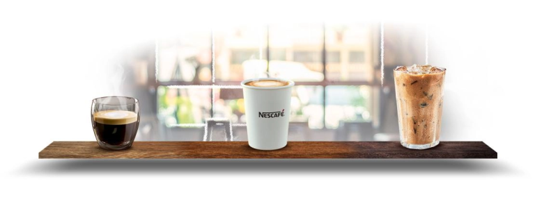 A wooden shelf with three drinks, arranged in glasses, presenting a colorful and inviting display.
