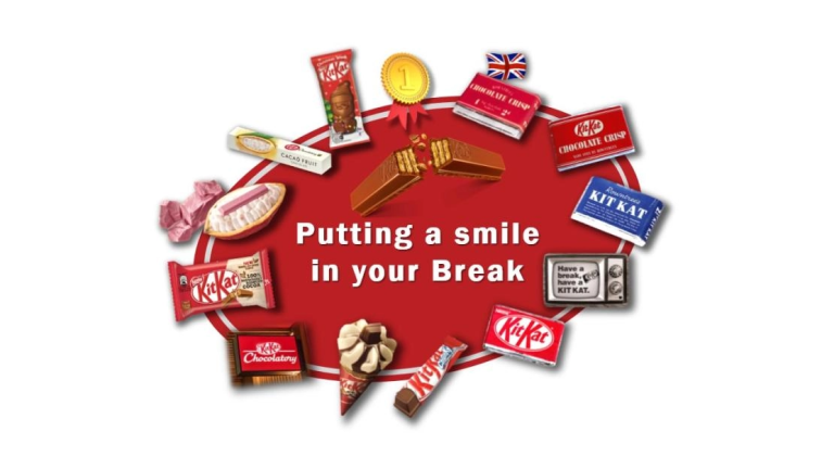 A red circle featuring the phrase "Putting a smile in your break" in a cheerful font.